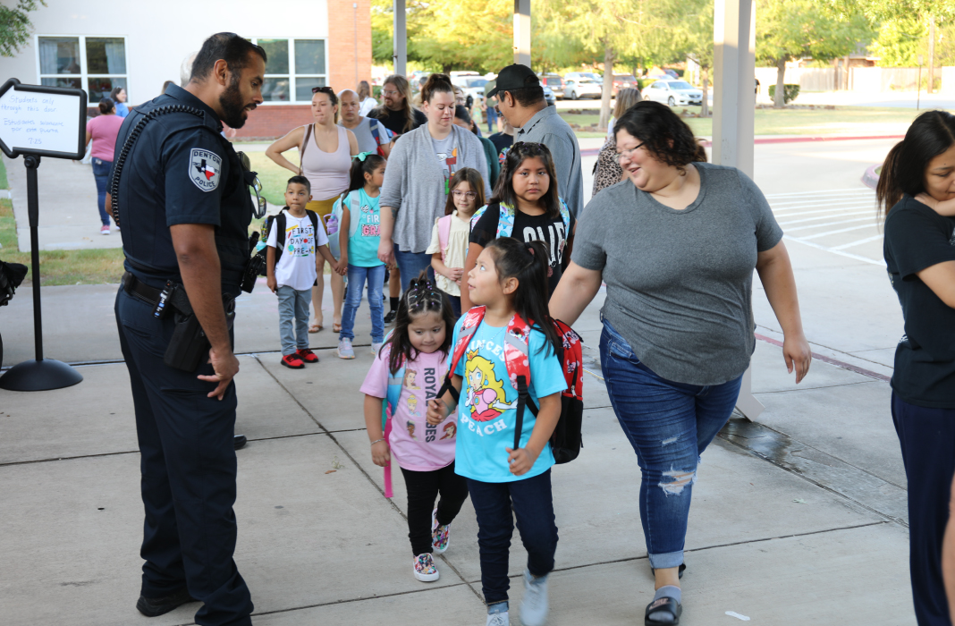 School Resource Officer assisting familes